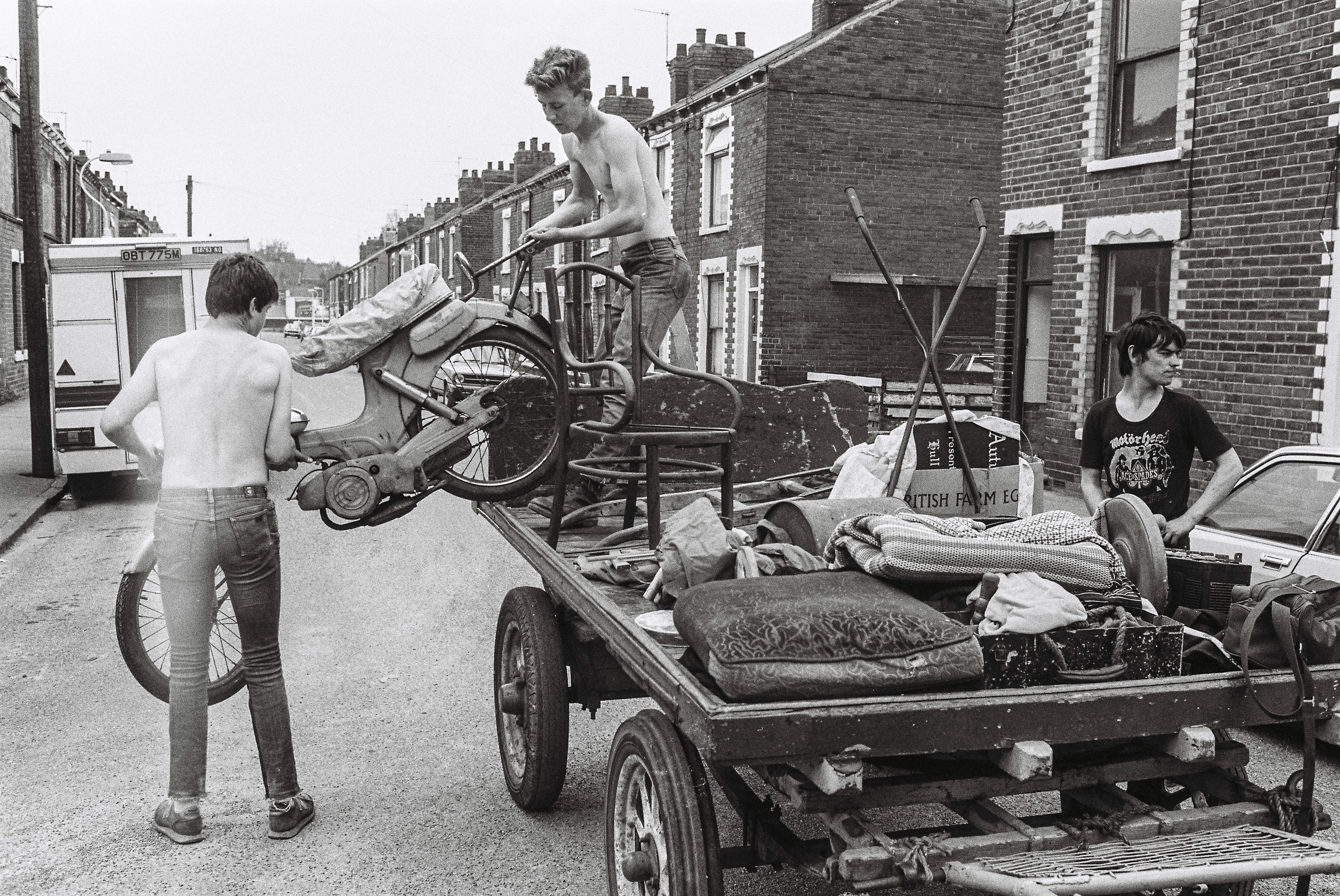 George Norris Jnr and Glen Collins loading a motorcycle onto a rulley in Stepney Lane, off Beverley Road, Hull. Picture: Russell Boyce