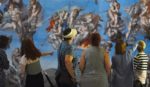 A group admires the spectacular, Last Judgement canvas replica by Michelangelo at the 13th century Great Hall in Winchester. © Zachary Culpin/Solent News and Photo Agency