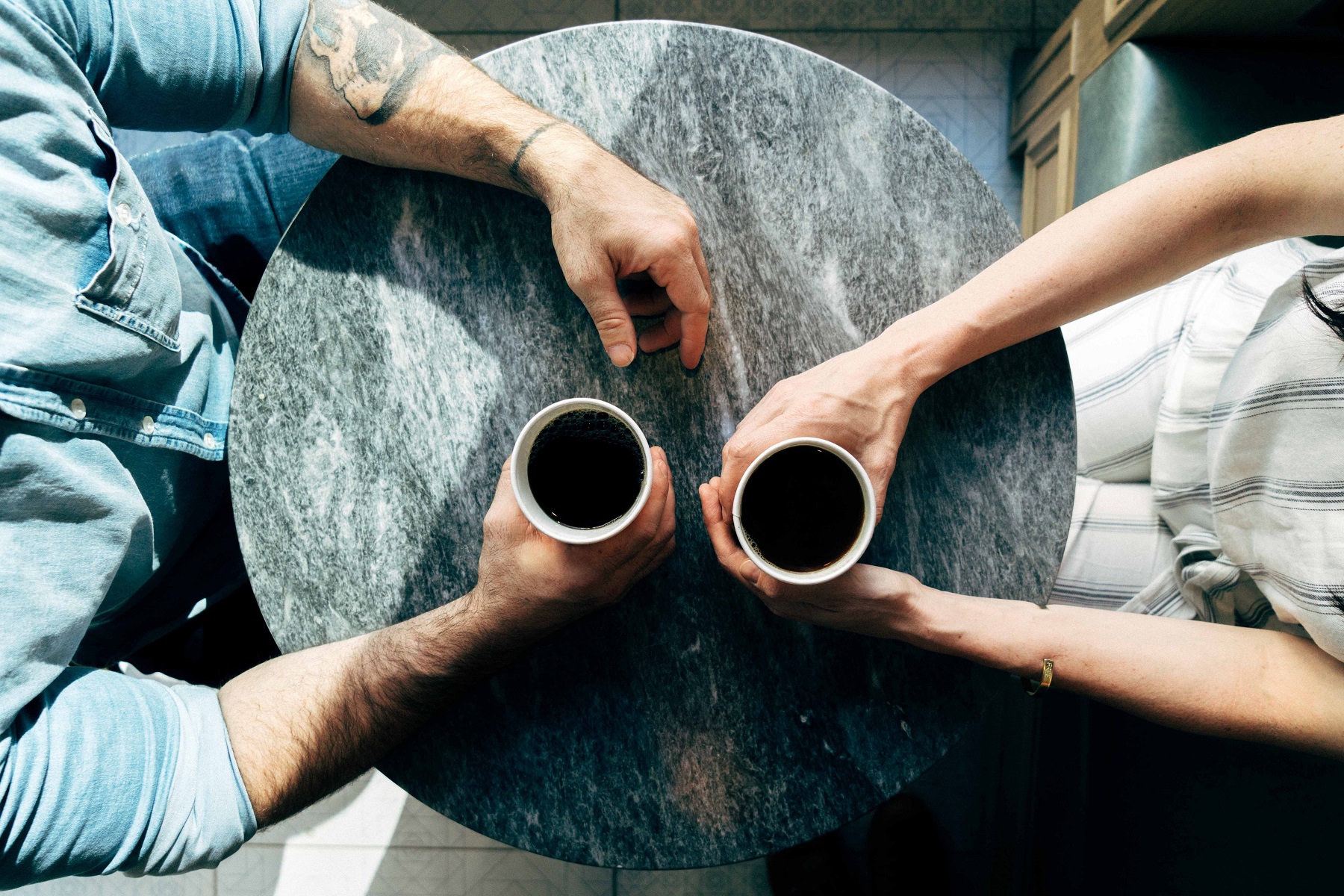 Two people meeting over coffee