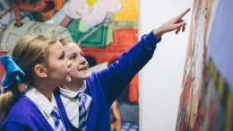 Children look at artwork