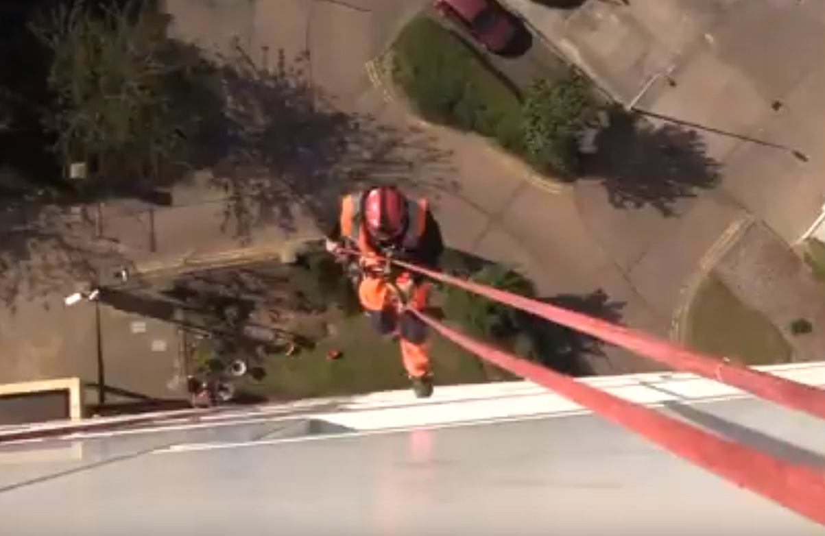 One of the abseilers who cleans cladding on Hull City Council's 26 tower blocks.