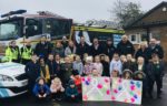 Pupils at Greenway Academy on Pupils at Green Way Academy were visited by a white ribbon-wrapped fire engine and police car to mark White Ribbon Day.White Ribbon Day.