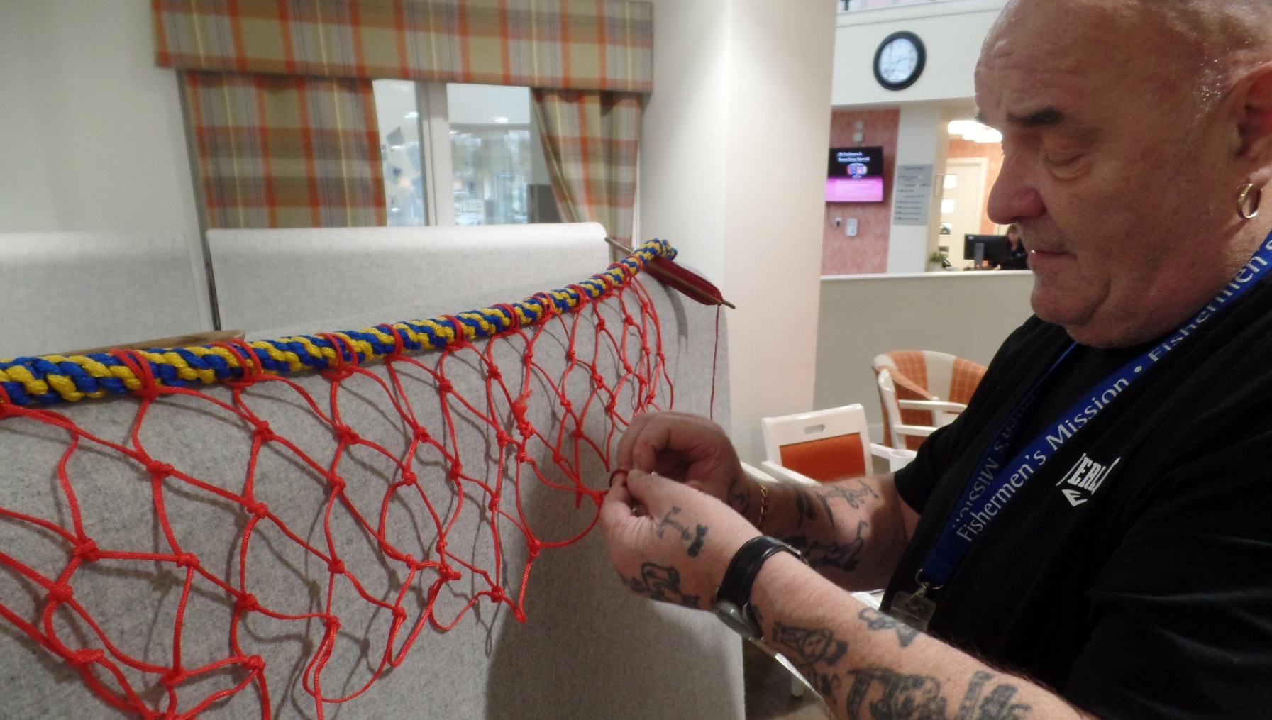 Volunteer Thomas Nielson with the fishing net display.