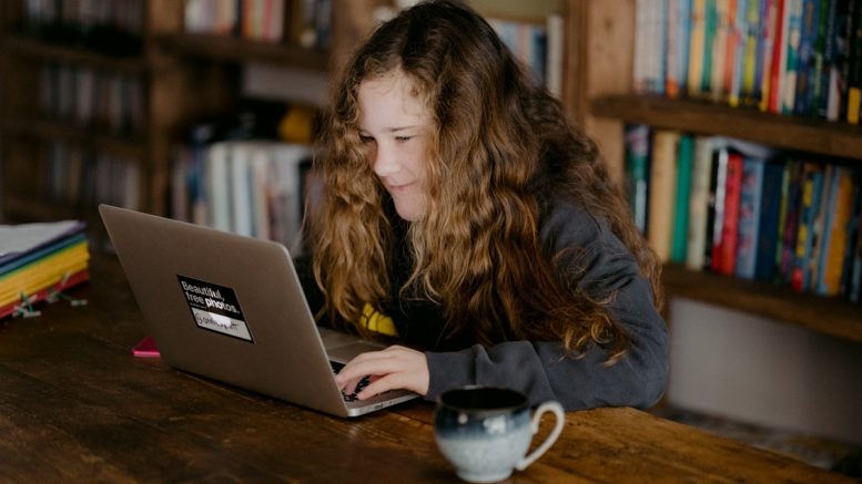 A girl at a laptop
