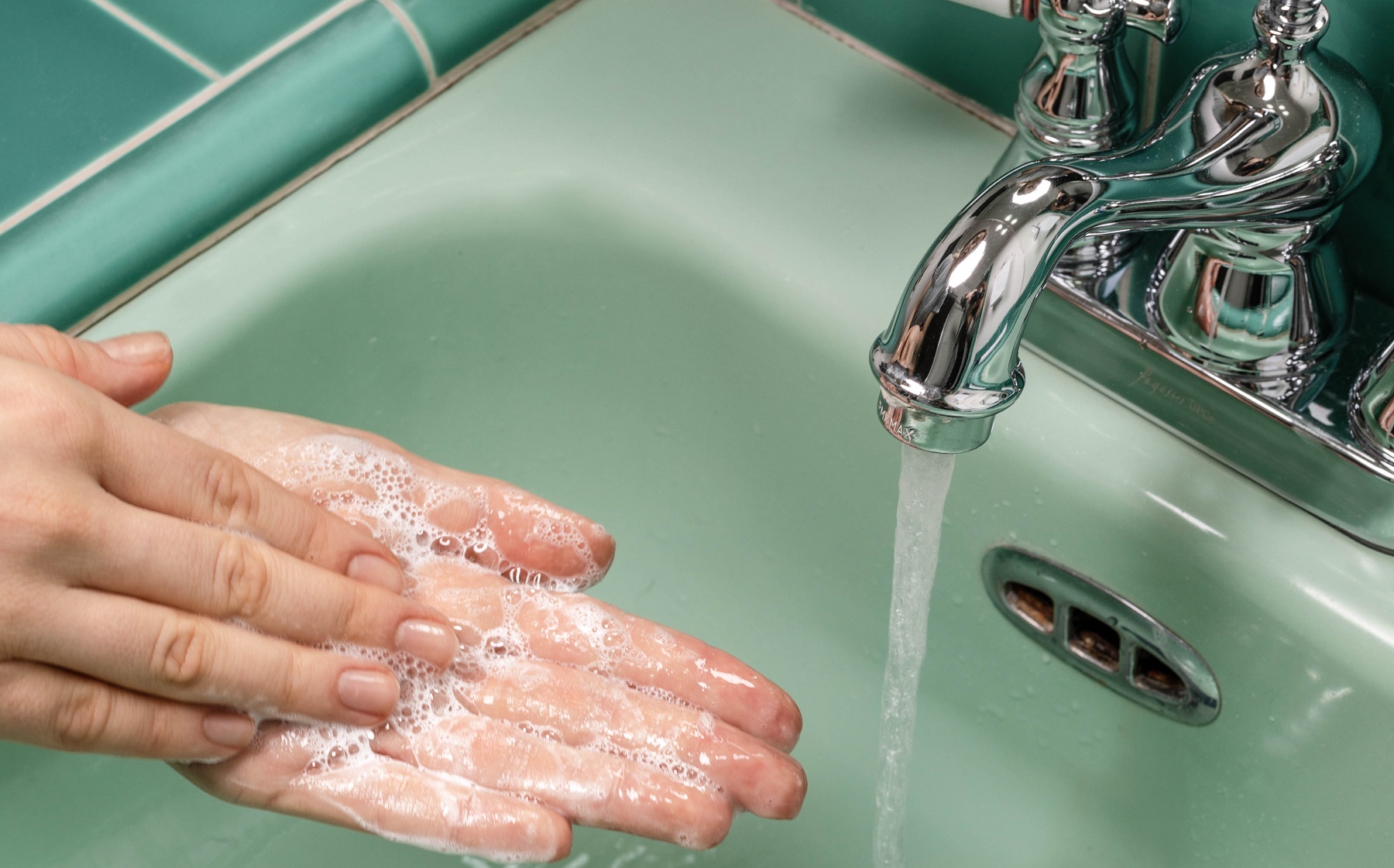 a person washing their hands