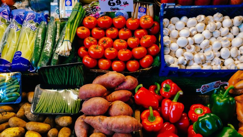 A selection of fruit and vegetables on a market stall. There is a variety of types and the image is very colourful. Picture by Dean Xavier