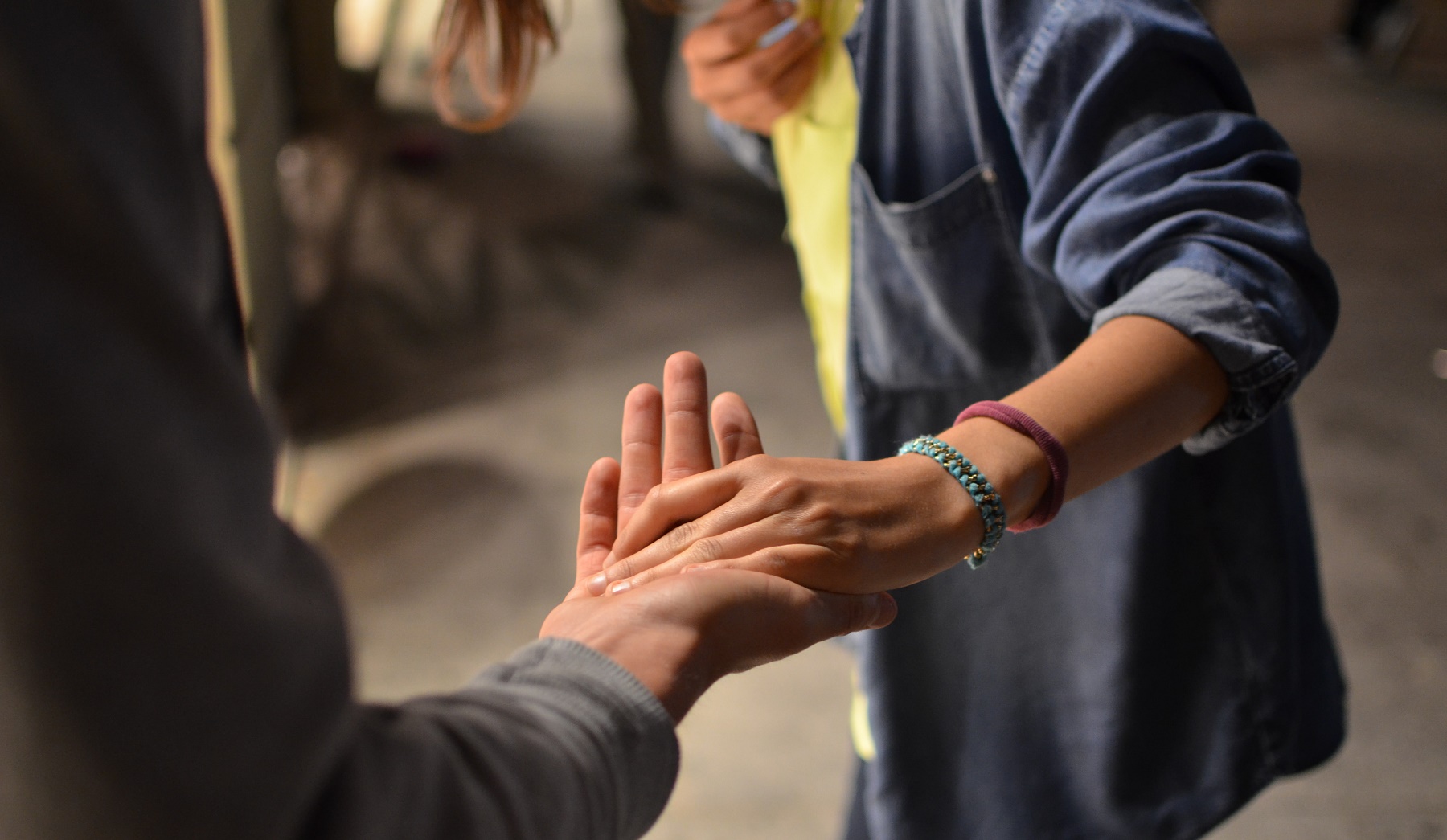 Two people holding hands