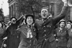 Two people celebrate VE Day in 1945.