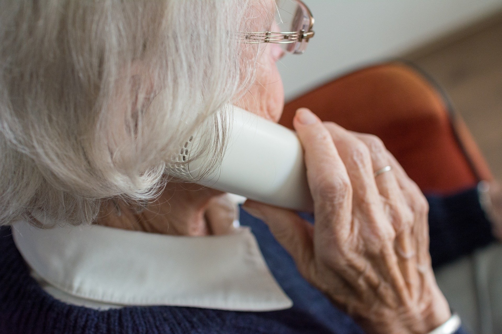 An elderly woman on the phone.