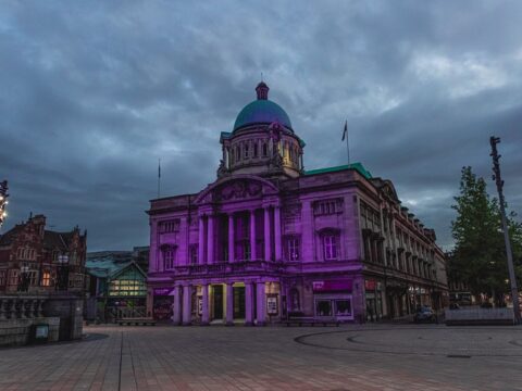 View article Hull buildings illuminated in purple in statement against racism