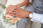 The hands of a bride and groom
