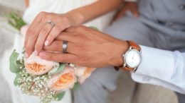 The hands of a bride and groom