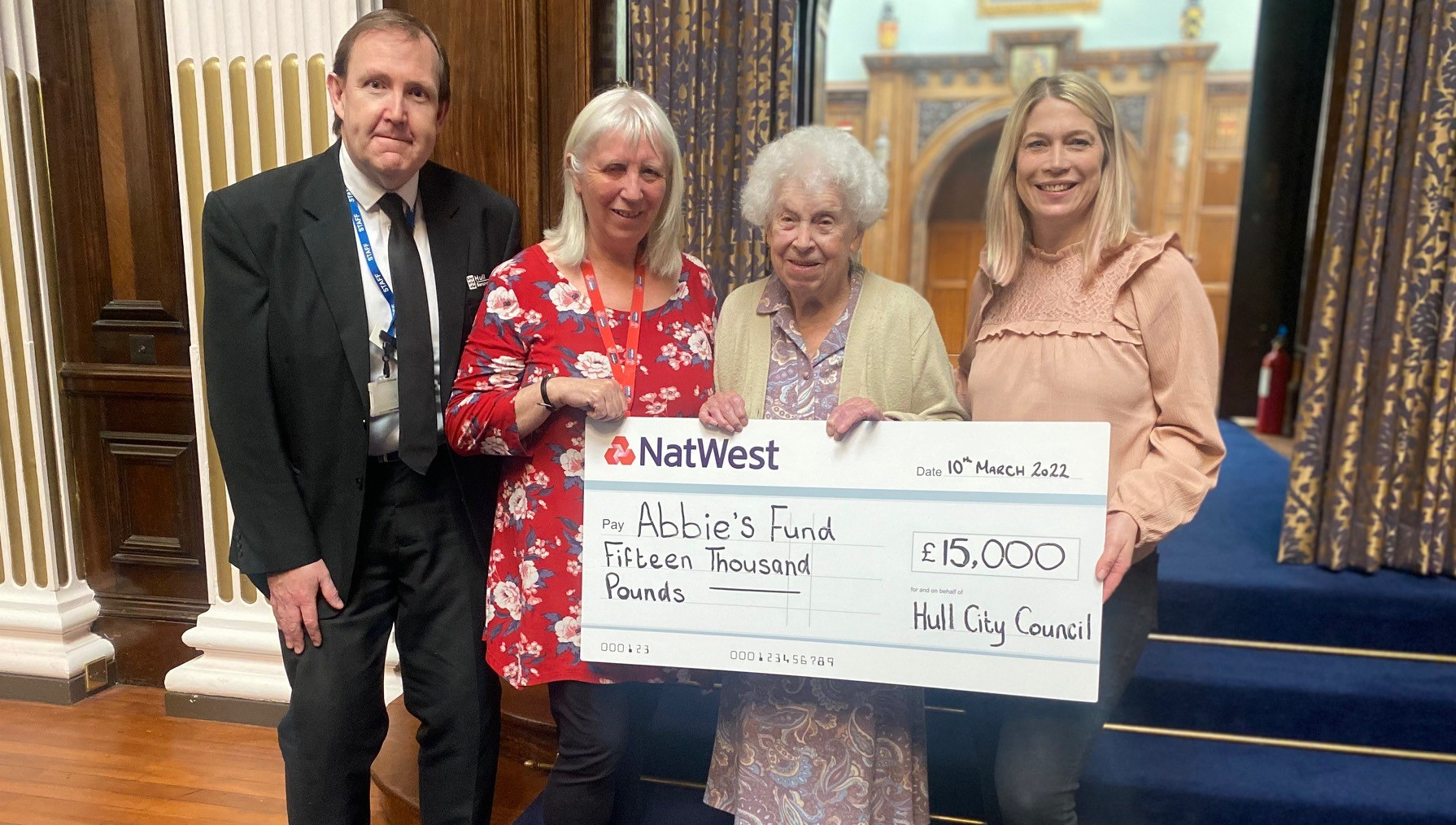 A cheque is presented to Abbie's Fund - (L-R) Richard Barker (Bereavement Services Manager), Cllr Rosie Nicola, Peggy Staveley (Cllr Nicola's mother), Katy Cowell.