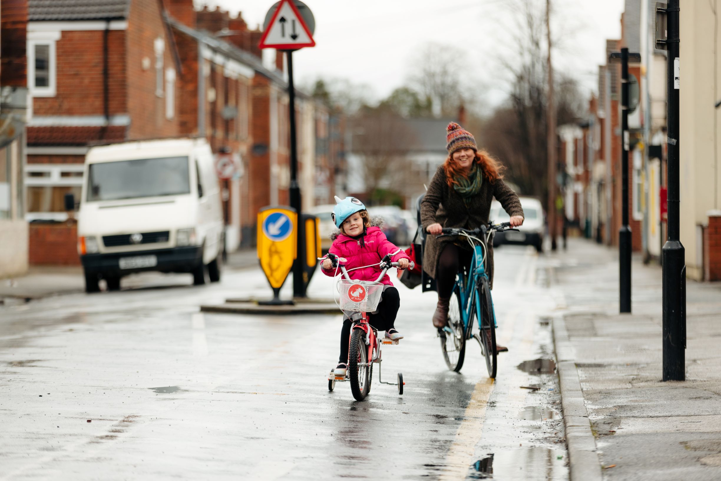 Parent and child cycling to school