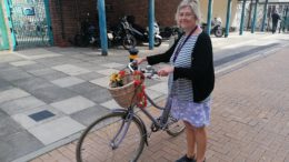 Kate with her bike which she uses to cycle to and from work.