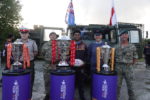 The rugby league world cup trophies with the Fiji captain and representatives from Normandy Barracks.