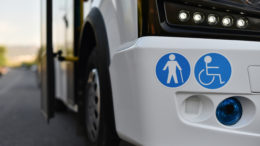 A bus with stickers of places for a disabled person and elderly on body