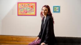 Artist Erin Ledsom pictured in front of her artwork paying tribute to the work of council workers during the Covid-19 pandemic.