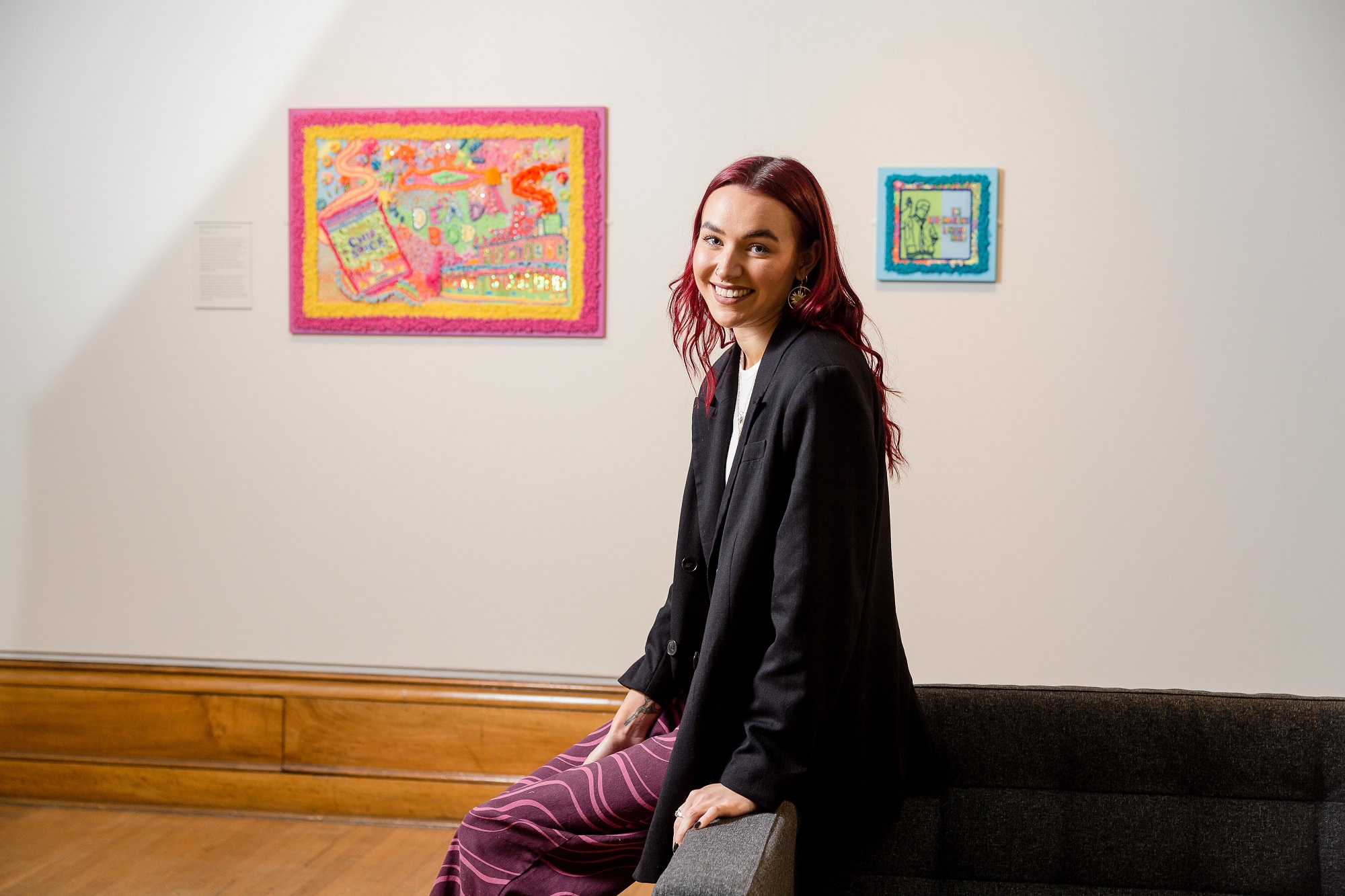 Artist Erin Ledsom pictured in front of her artwork paying tribute to the work of council workers during the Covid-19 pandemic.