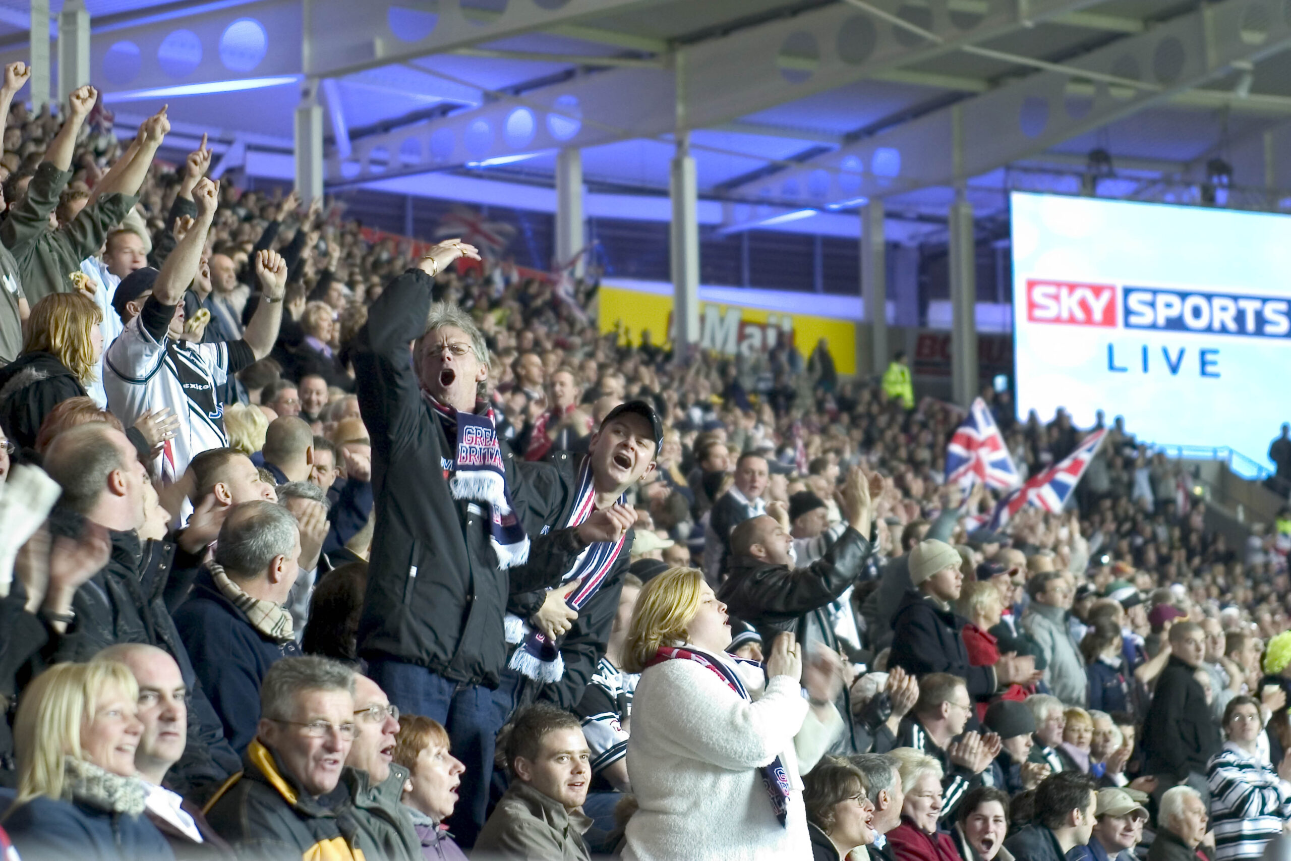A large crowd of rugby fans inside the MKM Stadium