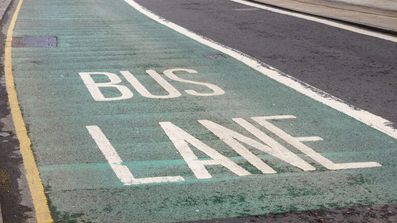 A bus lane with green paint