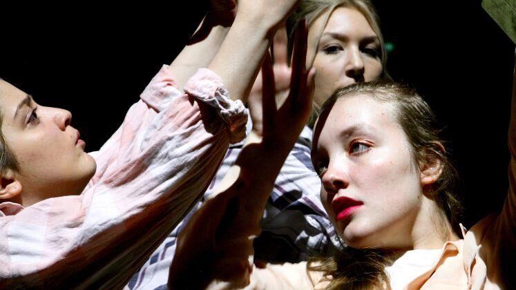 Young female dancers mid-performance