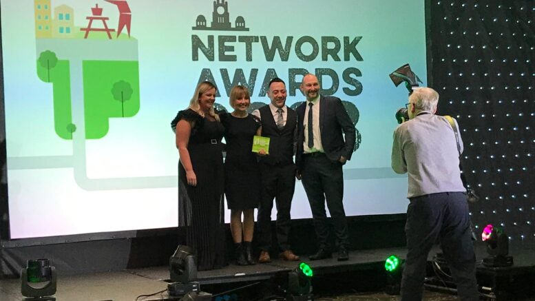 Hull City Council staff pose for a photograph on stage after winning the the award for Outstanding Service Delivery at the Keep Britain Tidy Awards 2023