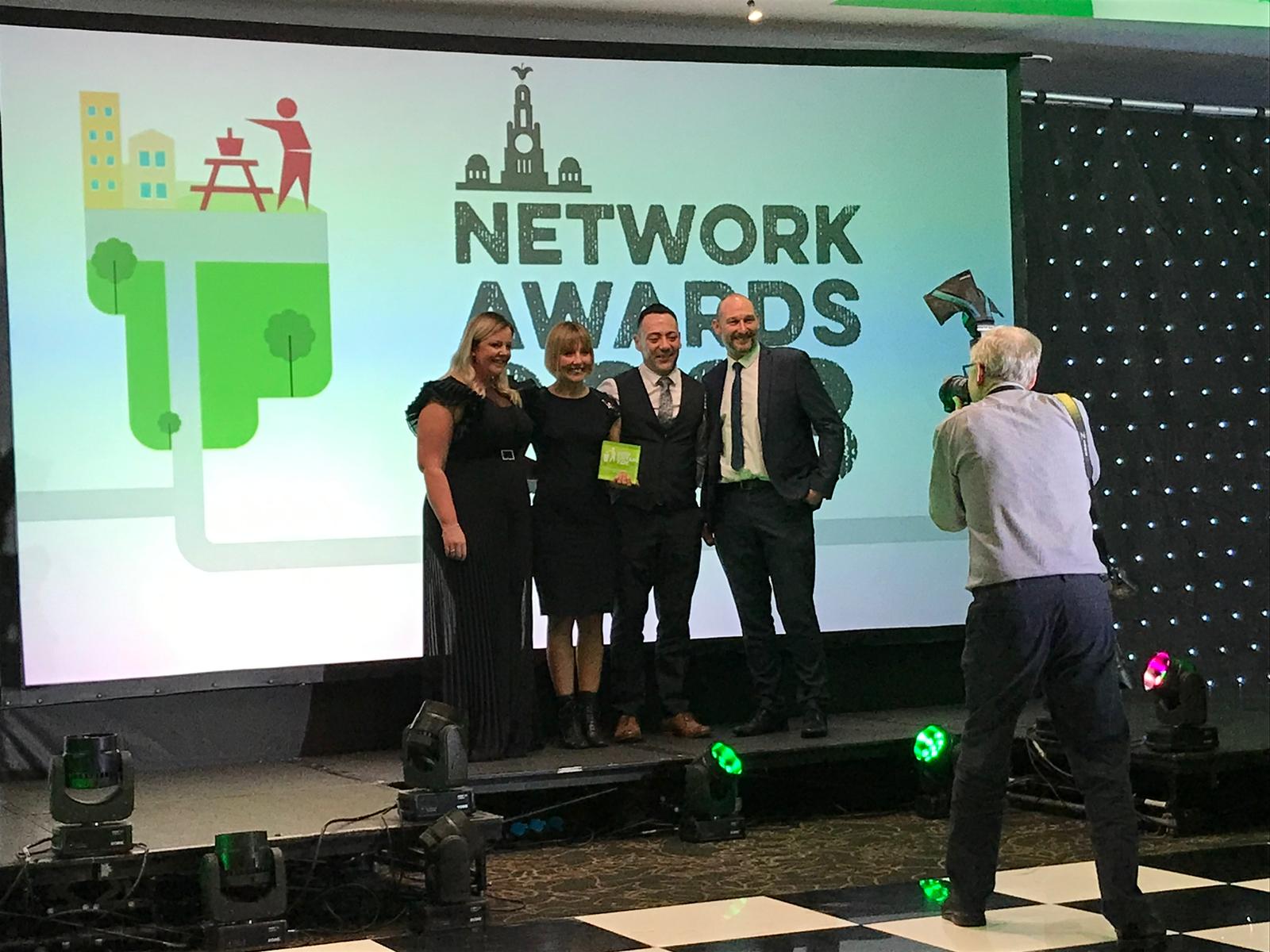 Hull City Council staff pose for a photograph on stage after winning the the award for Outstanding Service Delivery at the Keep Britain Tidy Awards 2023