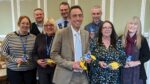 Members of Hull City Council's Cabinet holding Fairtrade bananas and chocolate.