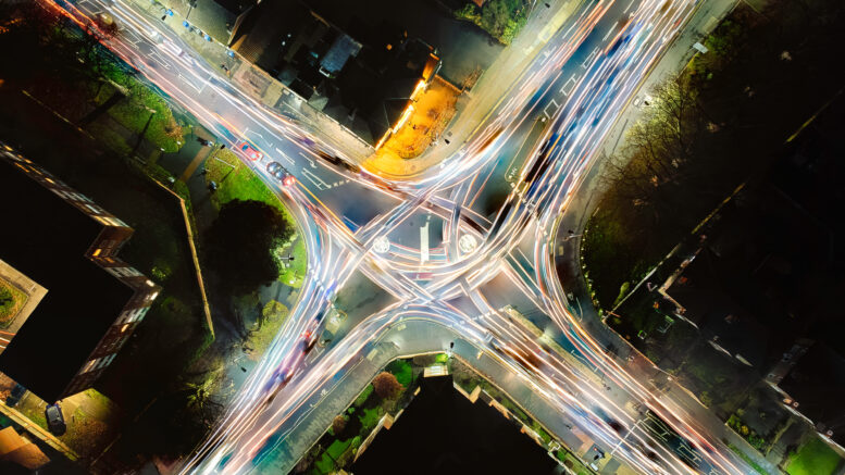 Looking down at the light trails on a roundabout in the UK