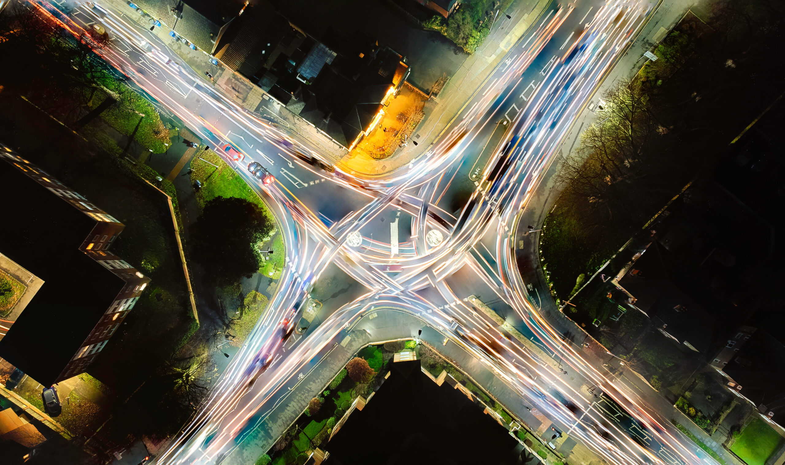 Looking down at the light trails on a roundabout in the UK