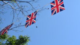 Union Jack bunting flying against blue sky