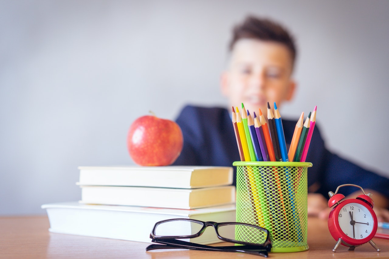 School child with school stationary.