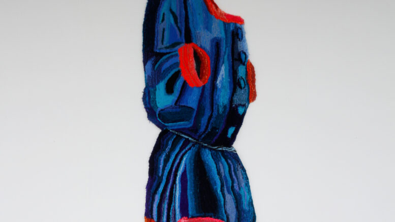 Blue and red woolen robe by artist Anna Brass