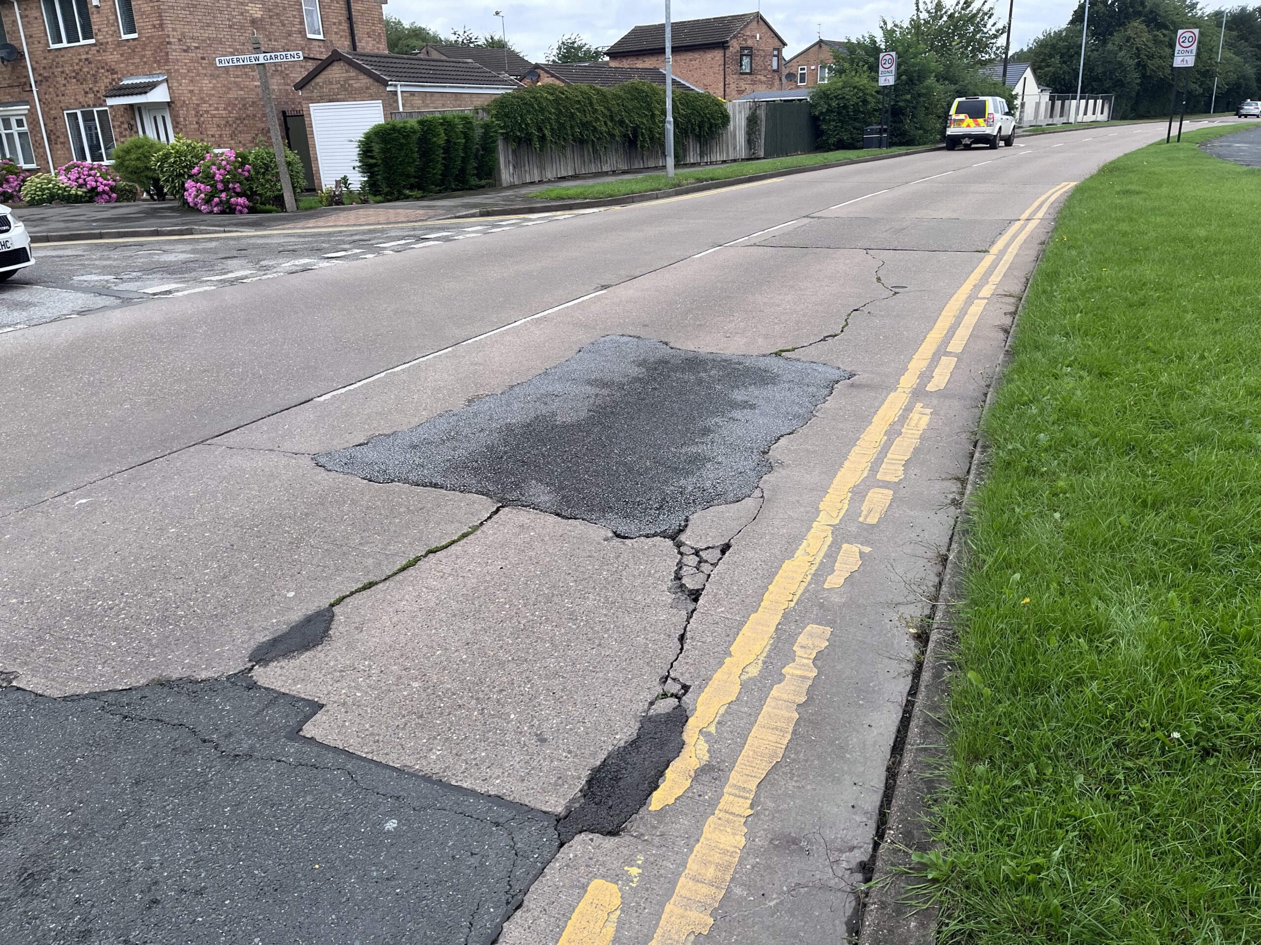 Failed carriageway at the junction of Riverview Gardens.