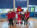 Pupils from Thanet Primary School with Rufus Robin, the Hull Kingston Rovers mascot.