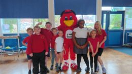 Pupils from Thanet Primary School with Rufus Robin, the Hull Kingston Rovers mascot.