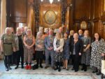 The image is of the Lord Mayor and Councillor Tock alongside the long serving foster carers. Everyone is smiling.