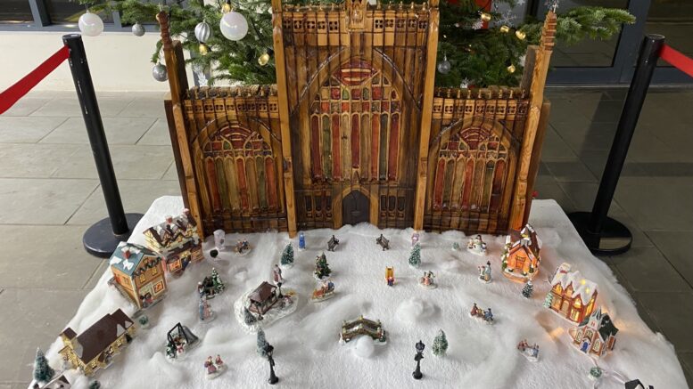 Display shows the front of Hull Minster in wood with a snow scene in front.