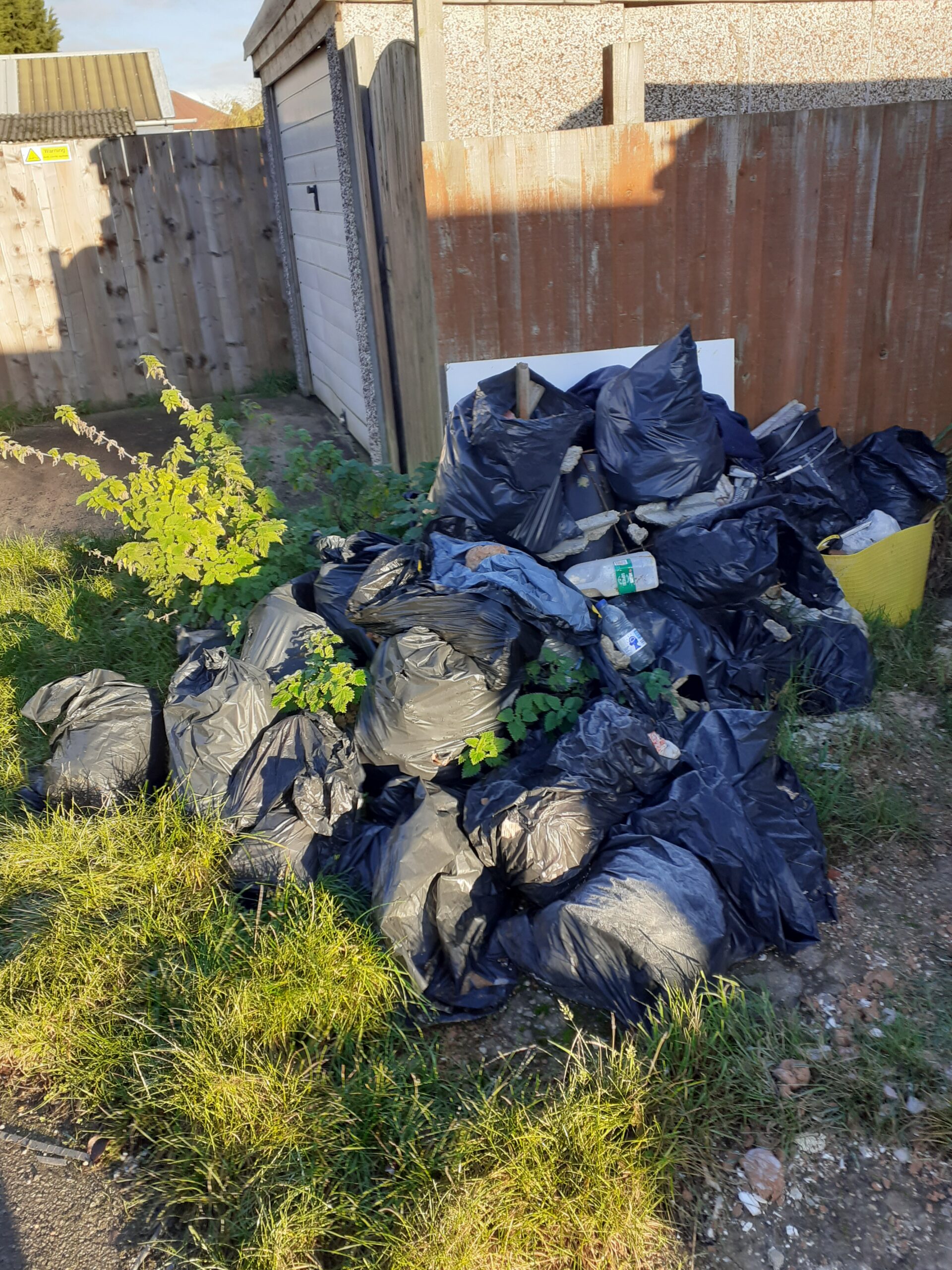Black bags full of rubbish at the property on Woodgate Road.