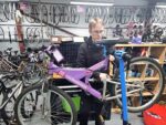 Jason Wigmore, cycle mechanic, working on a bike