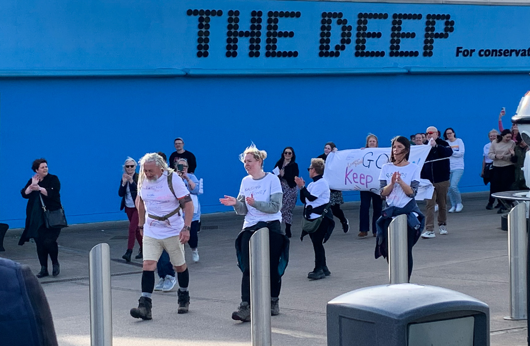 Father Phil and his supporters at The Deep