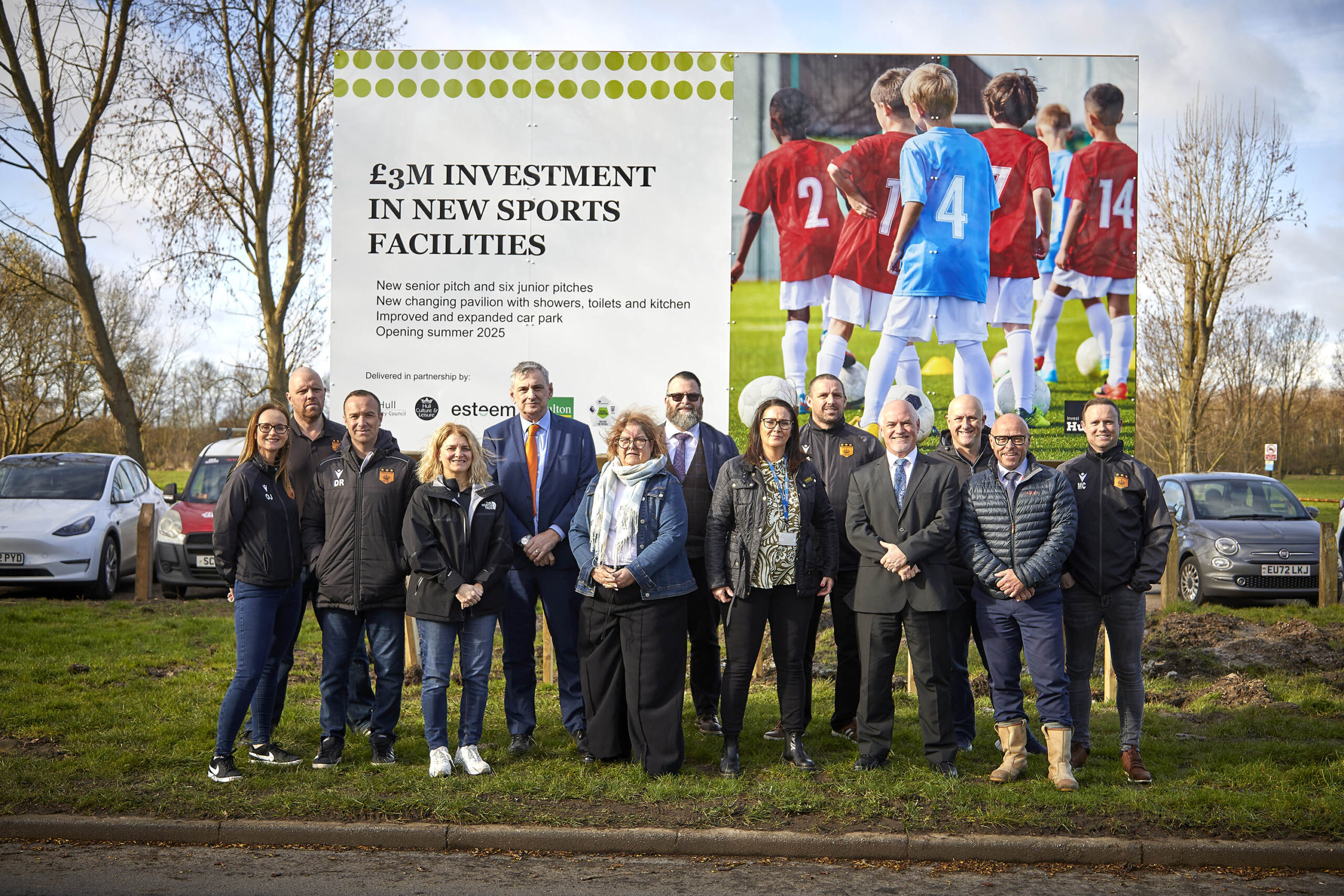 Cllr Rob Pritchard (fifth left) with fellow West Carr ward councillors and members of Hull City Council's major projects team, Hull Esteem, Geo. Houlton & Sons and Kingswood United in front of the Bude Park plans sign.