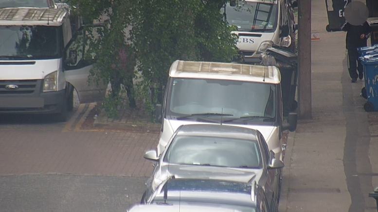 CCTV image shows a passenger of the vehicle owned by Mr Vorel Voicu fly-tipping waste on Mayfield Street, Hull, in May 2023.