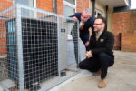 Ideal Heating Heat Pump Technical Sales Manager, John Jackson, right, and Cllr Paul Drake-Davis, Hull City Council’s Portfolio Holder for Housing, inspect one the heat pumps installed as part of the trial project.