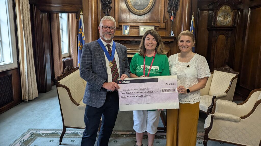 2023-24 Lord Mayor Cllr Kalvin Neal and past Lady Mayoress Cllr Tracey Neal hand over a cheque to Sue Nicholson from Dove House Hospice