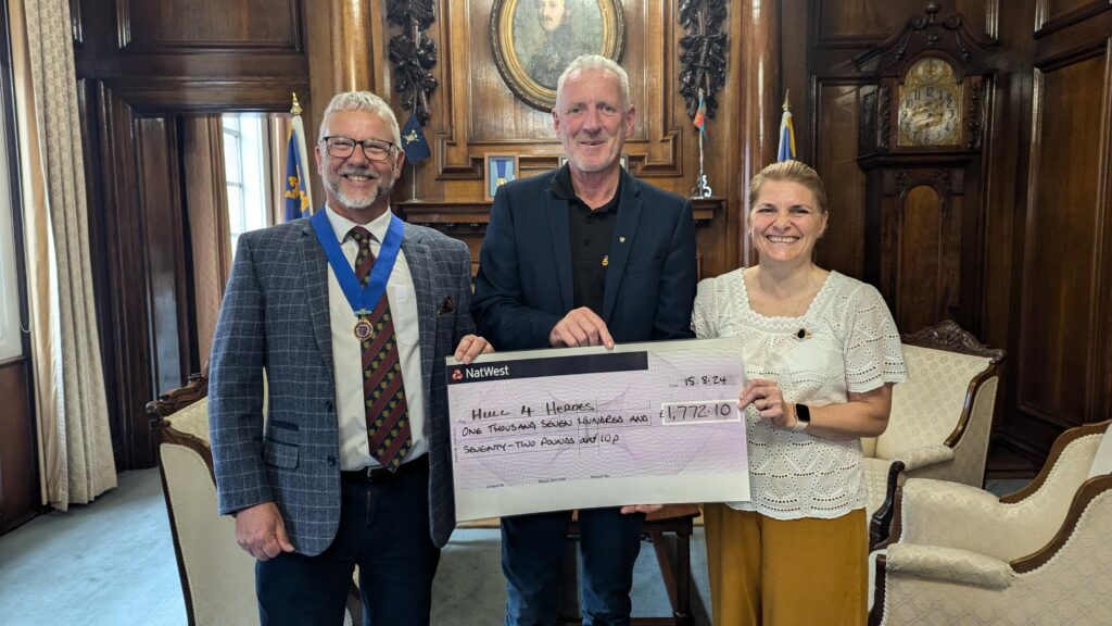 2023-24 Lord Mayor Cllr Kalvin Neal and past Lady Mayoress Cllr Tracey Neal hand over a cheque to Paul Matson from Hull 4 Heroes