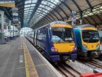 Image shows a Northern train and TransPennine Express train at Hull Paragon Interchange