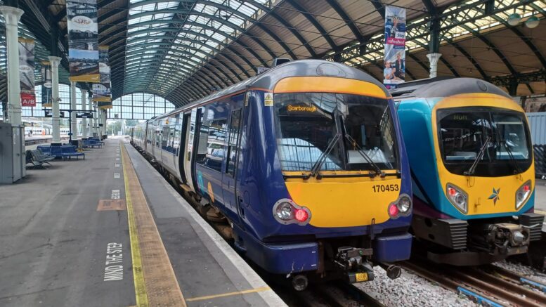 Image shows a Northern train and TransPennine Express train at Hull Paragon Interchange