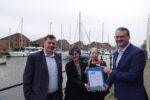 Councillor Mark Ieronimo presents the team from Holiday Inn Hull Marina with their latest Modeshift STARS certificate.